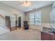 Cozy living room with natural light, plush carpeting, and comfortable seating at 1031 High Tide Ct, Loganville, GA 30052