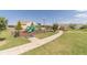 Community playground featuring colorful play structures, a swing set, and a well-maintained grassy area at 1031 High Tide Ct, Loganville, GA 30052