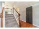 Inviting staircase with carpeted steps and white railings leading to the upper level at 1031 High Tide Ct, Loganville, GA 30052