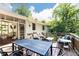 Spacious back deck ideal for entertaining, featuring dining and seating areas with views of the beautiful yard at 1295 Lindenwood Ne Ln, Brookhaven, GA 30319