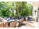 Inviting outdoor back deck with a comfortable seating area and a grill perfect for outdoor dining at 1295 Lindenwood Ne Ln, Brookhaven, GA 30319