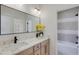 Modern bathroom with double sinks, marble counters, and a sleek mirror at 2745 S Bamby Ne Ln, Brookhaven, GA 30319