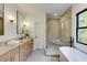 Luxurious bathroom with double vanity, sleek mirrors, soaking tub, and glass shower at 2745 S Bamby Ne Ln, Brookhaven, GA 30319