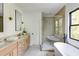 Elegant bathroom with double vanity, soaking tub, large shower and modern fixtures at 2745 S Bamby Ne Ln, Brookhaven, GA 30319