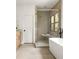 Elegant bathroom boasts walk-in shower, soaking tub and contemporary fixtures at 2745 S Bamby Ne Ln, Brookhaven, GA 30319