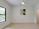 Bright bedroom with hardwood floors, a modern ceiling fan, and a large window at 2745 S Bamby Ne Ln, Brookhaven, GA 30319