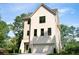 Beautifully designed home with brick and siding, complemented by black-framed windows and lush green surroundings at 2745 S Bamby Ne Ln, Brookhaven, GA 30319