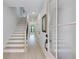 Bright hallway with staircase, light hardwood floors, and a modern design at 2745 S Bamby Ne Ln, Brookhaven, GA 30319