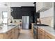 Well-appointed kitchen with stainless steel appliances, light wood cabinets, and marble countertops at 2745 S Bamby Ne Ln, Brookhaven, GA 30319