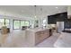 Bright and open kitchen features stainless appliances, marble countertops, an island and opens to the living area at 2745 S Bamby Ne Ln, Brookhaven, GA 30319