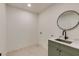 Clean laundry room featuring a sink, a marble countertop, and green cabinets at 2745 S Bamby Ne Ln, Brookhaven, GA 30319