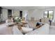 Expansive open-concept living room flows into the dining area and a modern kitchen with pendant lighting at 2745 S Bamby Ne Ln, Brookhaven, GA 30319