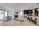 Open concept living area with a fireplace, modern kitchen, and stylish furnishings at 2745 S Bamby Ne Ln, Brookhaven, GA 30319