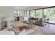 Bright and airy living space with access to the outdoors, hardwood floors, and modern decor at 2745 S Bamby Ne Ln, Brookhaven, GA 30319