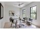 Stylish home office with natural light features modern decor, wood floors, and a comfortable seating area at 2745 S Bamby Ne Ln, Brookhaven, GA 30319