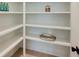 Walk-in pantry offers ample storage space with built-in shelving, perfect for organizing kitchen essentials at 2745 S Bamby Ne Ln, Brookhaven, GA 30319