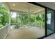 Covered porch boasts an outdoor ceiling fan and overlooks a private wooded lot, perfect for relaxation at 2745 S Bamby Ne Ln, Brookhaven, GA 30319