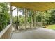 Outdoor living space featuring a vaulted wood ceiling, white pillars and a lush view at 2745 S Bamby Ne Ln, Brookhaven, GA 30319