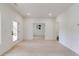 Spacious room with light hardwood flooring, white walls and access to outdoor living at 2745 S Bamby Ne Ln, Brookhaven, GA 30319