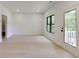 Light filled room featuring hardwood floors, bright walls and access to a balcony at 2745 S Bamby Ne Ln, Brookhaven, GA 30319
