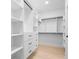 Spacious walk-in closet with custom shelves, drawers, and hanging rods offers ample storage at 2745 S Bamby Ne Ln, Brookhaven, GA 30319