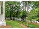 Beautifully landscaped yard featuring green grass, privacy and a view of the house at 2745 S Bamby Ne Ln, Brookhaven, GA 30319