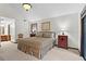 Bedroom with natural light, ensuite bathroom, and views of the outdoor patio at 895 Fawn Way, Marietta, GA 30068