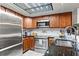 Modern kitchen design with stainless steel appliances, custom cabinetry, and granite countertops at 895 Fawn Way, Marietta, GA 30068