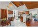 Large kitchen with wood cabinets, breakfast bar, adjacent to a dining area with views at 895 Fawn Way, Marietta, GA 30068