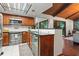 The kitchen has granite countertops, stainless steel appliances and a decorative ceiling light at 895 Fawn Way, Marietta, GA 30068