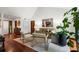 Bright living room featuring hardwood floors, a vaulted ceiling, comfortable furniture, and large windows at 895 Fawn Way, Marietta, GA 30068