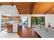 View of the kitchen leading to the living room with deck access and vaulted ceilings at 895 Fawn Way, Marietta, GA 30068