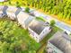 A high angle of residential homes exhibiting well-kept lawn areas and tree-lined streets within a neighborhood at 1838 Lakeview Bend Way, Buford, GA 30519