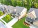 Aerial shot showcases home's placement in the community and manicured lawns in a desirable neighborhood at 1838 Lakeview Bend Way, Buford, GA 30519