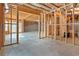 Unfinished basement with exposed framing and concrete floor ready to be built out at 1838 Lakeview Bend Way, Buford, GA 30519