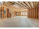 Spacious unfinished basement with framed walls, concrete floor and natural light at 1838 Lakeview Bend Way, Buford, GA 30519