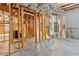 Unfinished basement with exposed pipes and framing for custom build-out at 1838 Lakeview Bend Way, Buford, GA 30519