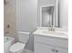 Bathroom featuring a tiled shower-tub combo, toilet, and modern vanity at 1838 Lakeview Bend Way, Buford, GA 30519