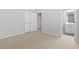 Bedroom featuring neutral carpet and an ensuite bathroom at 1838 Lakeview Bend Way, Buford, GA 30519