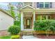 Inviting front entrance with brick accents, stone steps, and manicured shrubs at 1838 Lakeview Bend Way, Buford, GA 30519