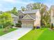 Charming two-story home featuring a brick facade, manicured lawn, and a two-car garage at 1838 Lakeview Bend Way, Buford, GA 30519
