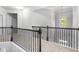 Hallway with metal railing and carpet floor at 1838 Lakeview Bend Way, Buford, GA 30519