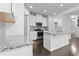 Kitchen with white cabinets, granite countertops, and stainless steel appliances at 1838 Lakeview Bend Way, Buford, GA 30519