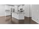 Kitchen features an island, stainless steel appliances, and a modern design at 1838 Lakeview Bend Way, Buford, GA 30519