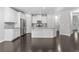 Open kitchen with granite countertops, stainless steel appliances, and white cabinetry at 1838 Lakeview Bend Way, Buford, GA 30519