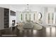 A bright, staged living room with fireplace, modern lighting, and view to backyard at 1838 Lakeview Bend Way, Buford, GA 30519