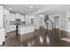 Open floor plan with an island kitchen, fireplace, and hardwood floors at 1838 Lakeview Bend Way, Buford, GA 30519