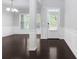 Spacious living room featuring hardwood floors, wainscotting, and abundant natural light at 1838 Lakeview Bend Way, Buford, GA 30519