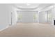 Spacious main bedroom features neutral colors, large windows, and trey ceiling detail at 1838 Lakeview Bend Way, Buford, GA 30519