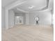 Open and airy main bedroom featuring plush carpeting, tray ceilings, and doorways at 1838 Lakeview Bend Way, Buford, GA 30519